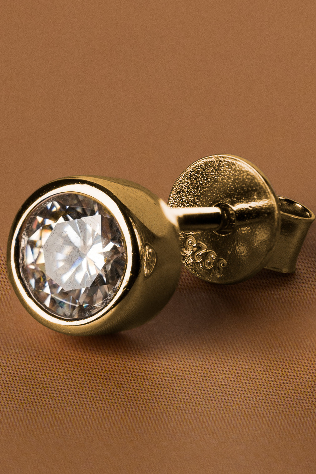 Veyelle Cercle moissanite bezel stud earrings in golden gold — close-up
