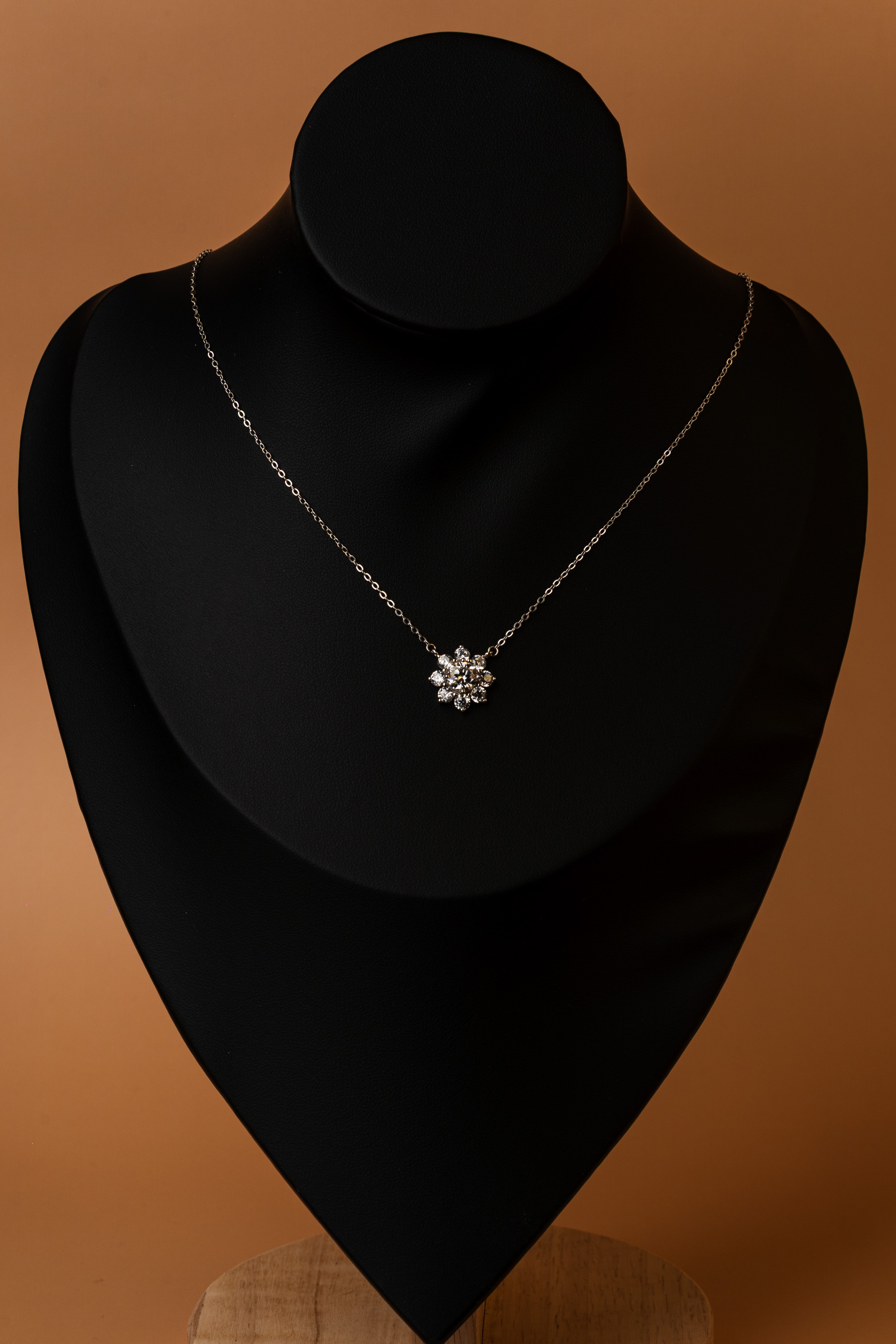 Veyelle Neve moissanite snowflake necklace in white gold — on model