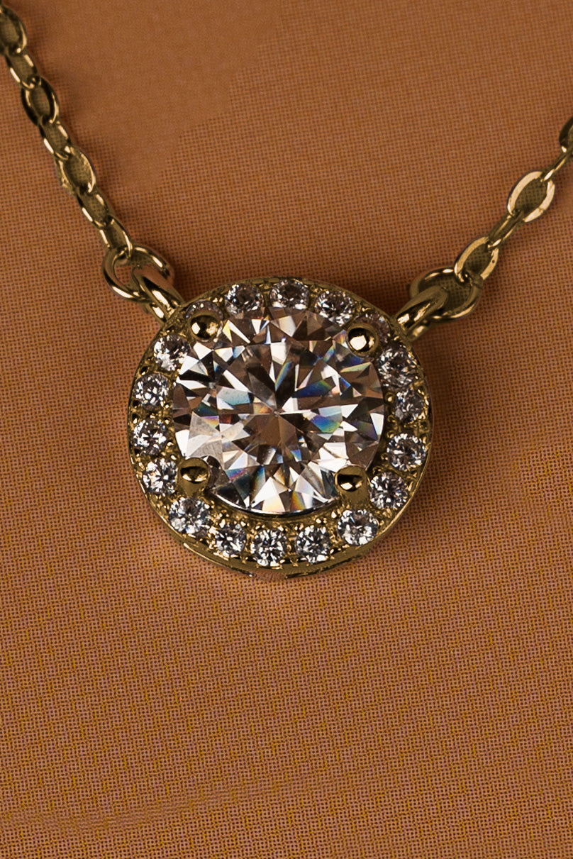 Veyelle Lumière moissanite station necklace in golden gold — close-up