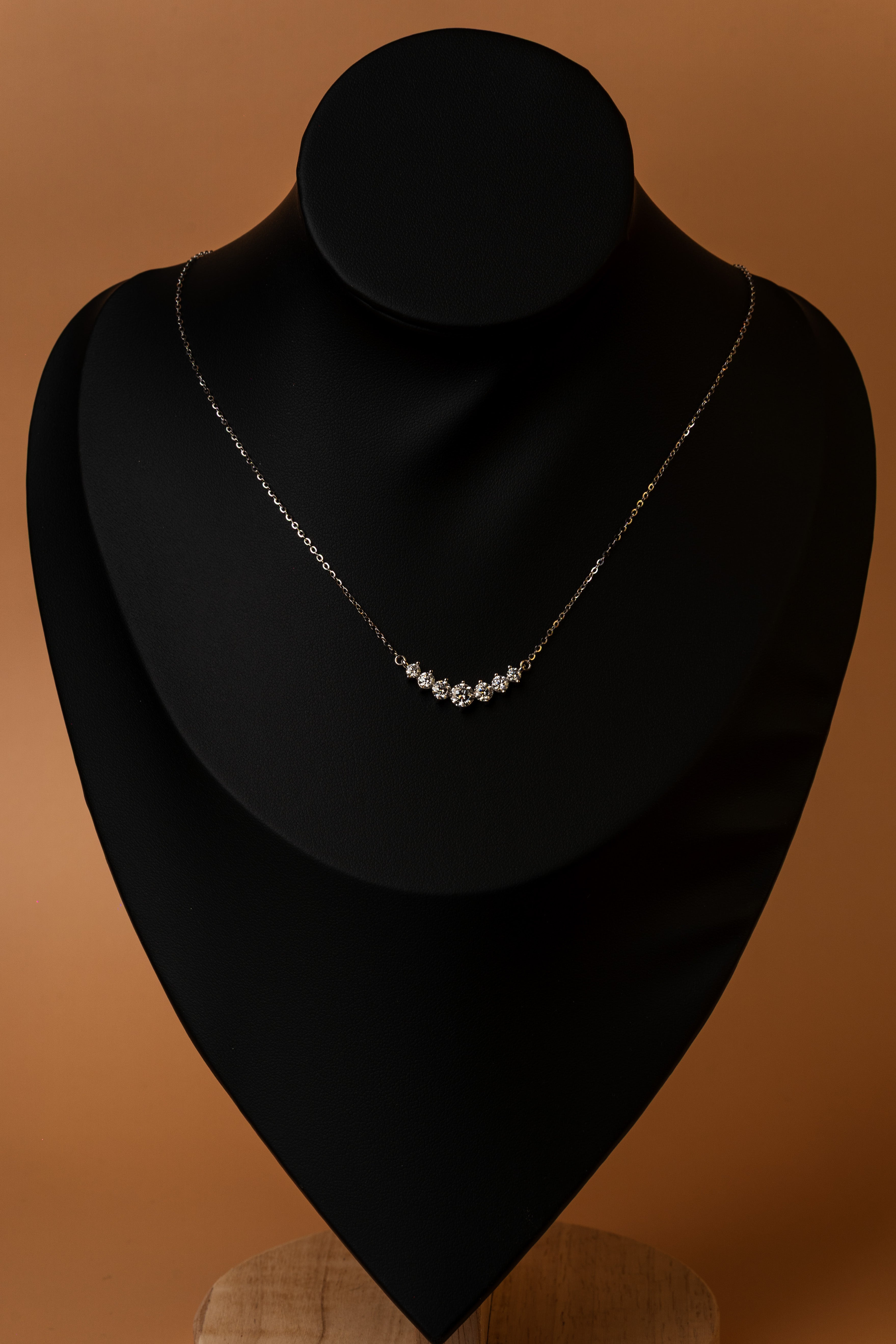 Veyelle Celestine moissanite graduated necklace in white gold — on model
