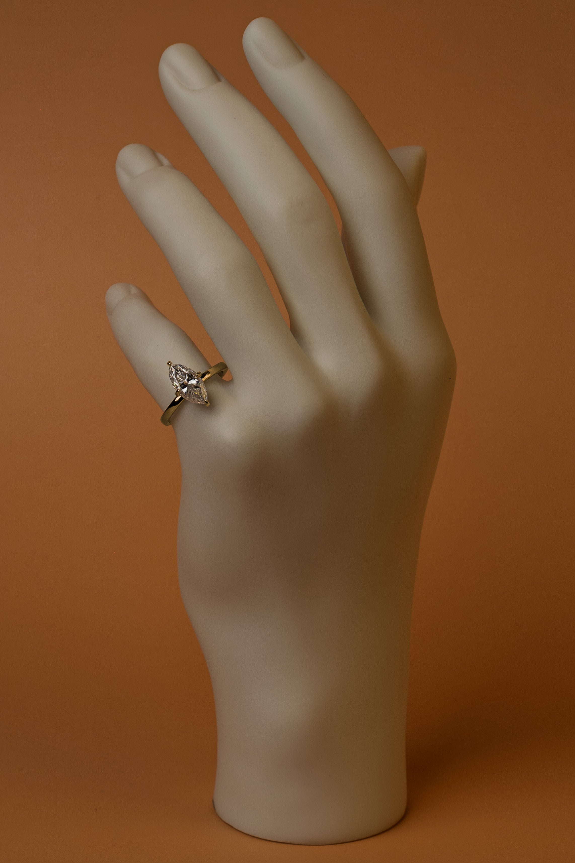 Veyelle Lança moissanite marquise ring in golden gold — on model