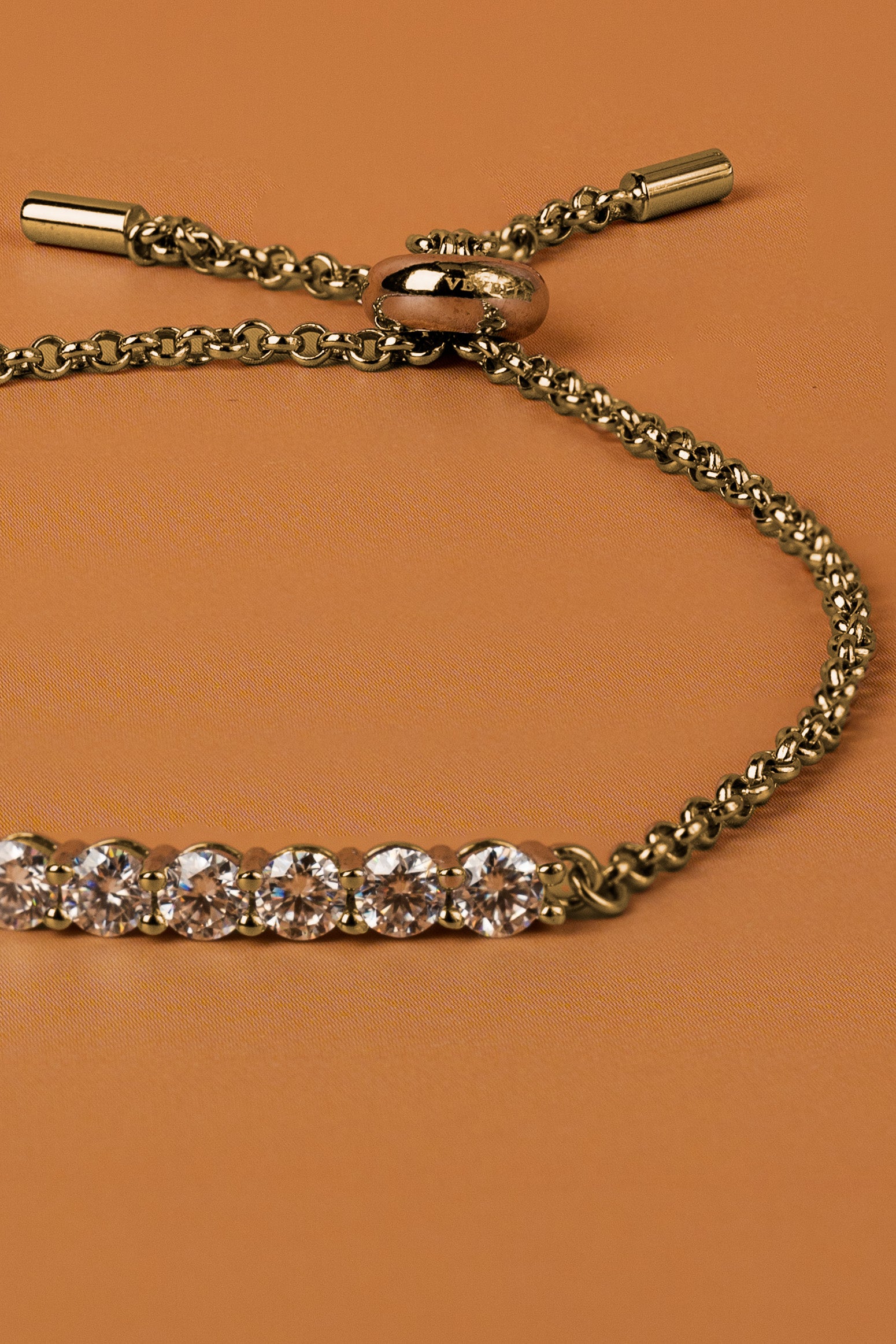 Veyelle Demi moissanite station bracelet in golden gold — close-up